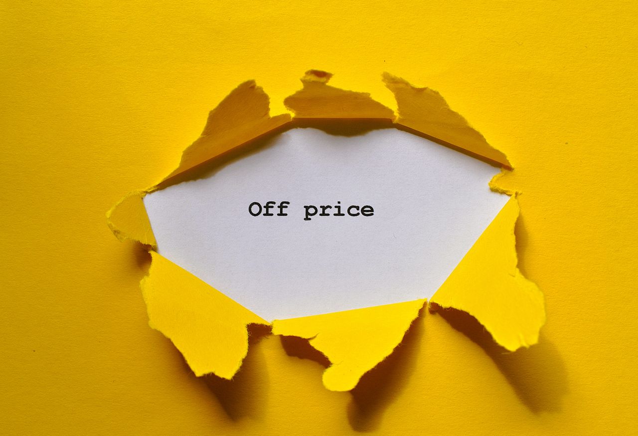 Yellow torn paper revealing 'Off price' for sale and discount promos.